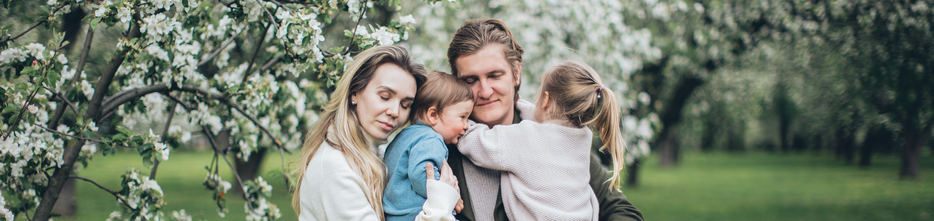 Life Insurance In Spokane Washington - Family of four hugging each other